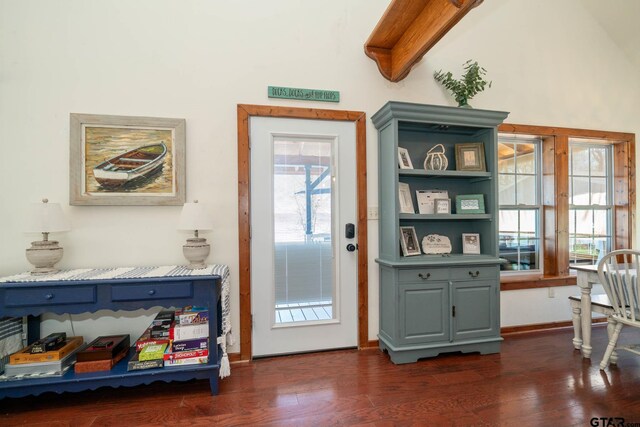 entryway with baseboards, lofted ceiling with beams, and dark wood-style flooring
