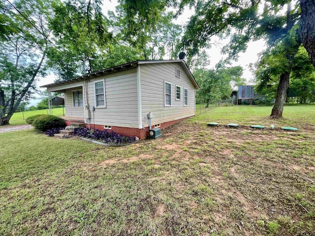 129 An County Rd 302, Frankston, TX 75763 - view of property exterior featuring a lawn and crawl space