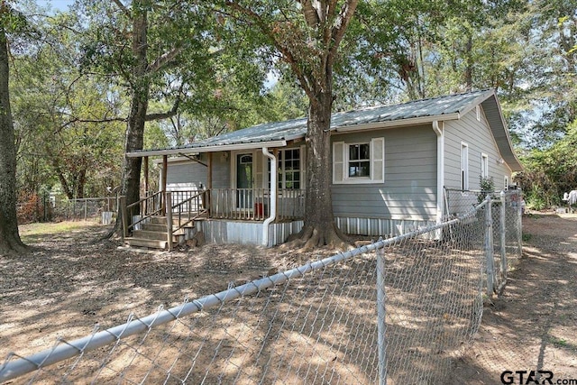 182 Moses St, Rusk, TX 75785 - view of front facade featuring a porch and a metal roof