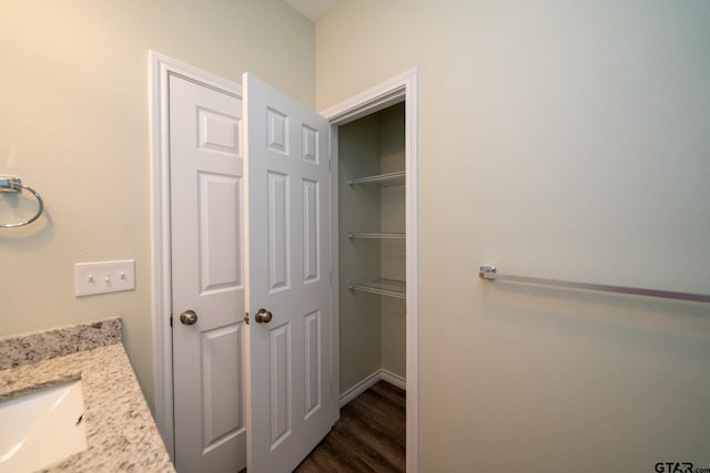 bathroom featuring vanity and hardwood / wood-style floors