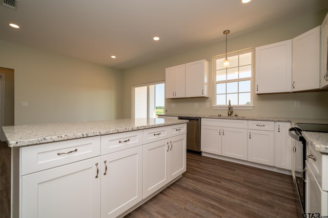 kitchen with dark hardwood / wood-style flooring, electric stove, decorative light fixtures, and a healthy amount of sunlight