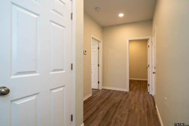 hallway featuring dark hardwood / wood-style flooring