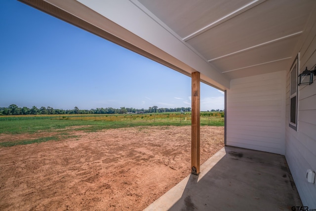 view of yard with a rural view