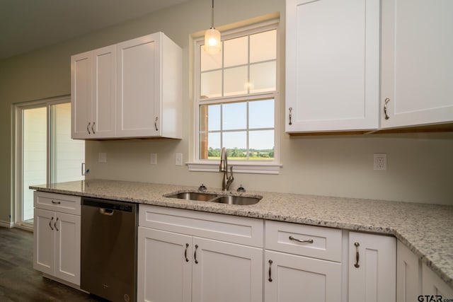 kitchen featuring dark wood-type flooring, pendant lighting, sink, white cabinets, and dishwasher