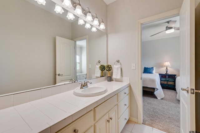 bathroom featuring vanity, ceiling fan, and tile patterned flooring