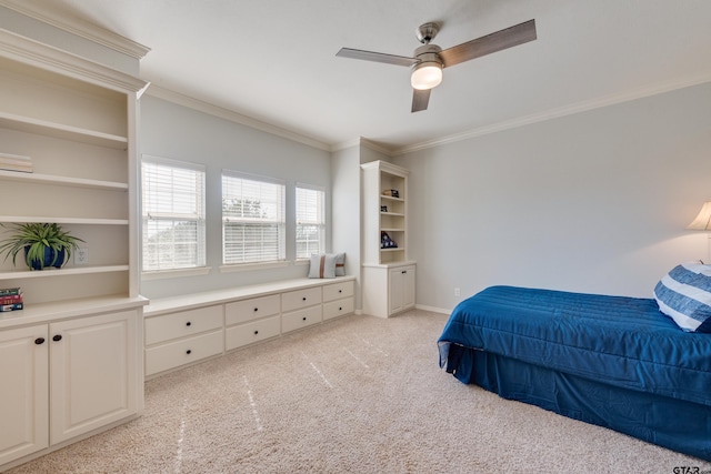 carpeted bedroom with ceiling fan and crown molding