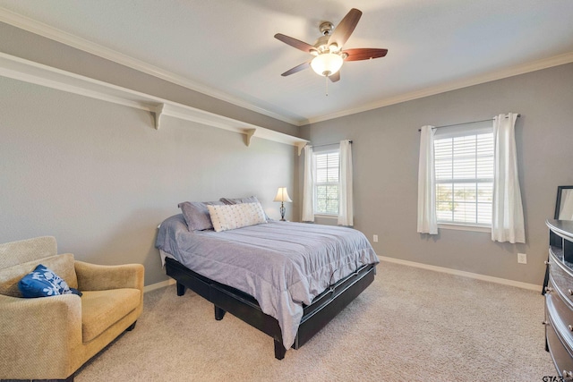 carpeted bedroom featuring ornamental molding and ceiling fan