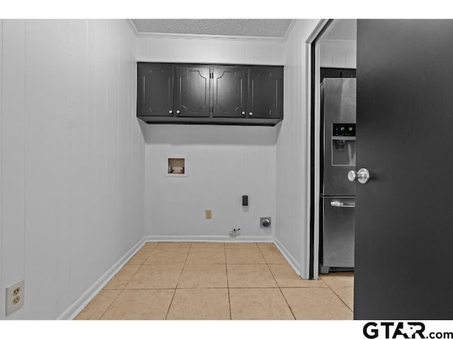 526 Ronnette Dr, Tyler, TX 75703 - laundry area featuring cabinet space, hookup for a gas dryer, washer hookup, crown molding, and light tile patterned floors
