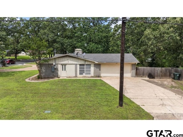 526 Ronnette Dr, Tyler, TX 75703 - view of front of property featuring concrete driveway, an attached garage, and view of wooded area