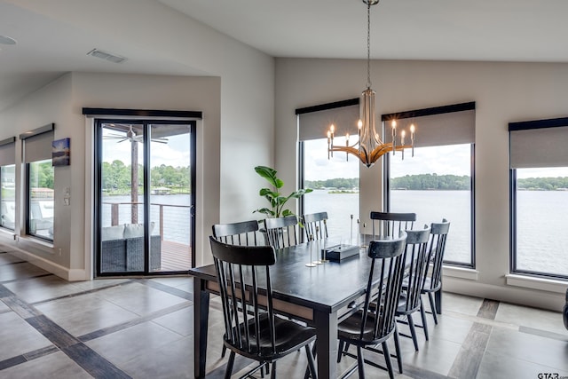 16822 Perry St, Tyler, TX 75707 - dining area featuring inlaid floor details, lofted ceiling, a chandelier, and a water view