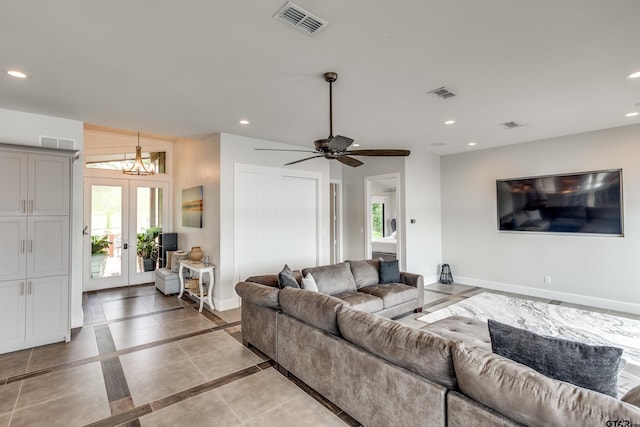 16822 Perry St, Tyler, TX 75707 - living room with inlaid floor details, recessed lighting, healthy amount of natural light, french doors, and a chandelier