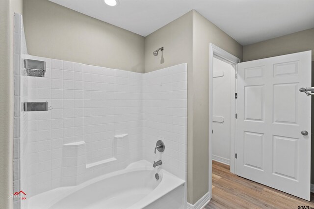 108 Benny St, Longview, TX 75604 - bathroom with wood finished floors, shower / bathtub combination, and baseboards
