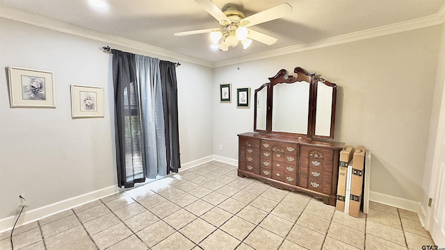 spare room featuring ornamental molding, light tile patterned floors, and ceiling fan