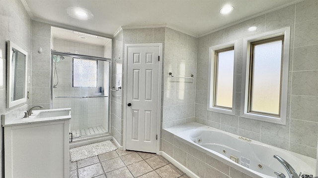 bathroom featuring vanity, crown molding, tile patterned floors, and plus walk in shower