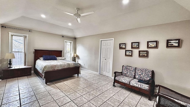 bedroom featuring multiple windows, light tile patterned floors, and ceiling fan