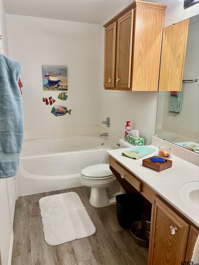 10764 Southern Trace Cir, Flint, TX 75762 - full bathroom with wood finished floors, a bath, toilet, and vanity