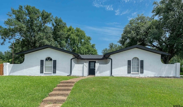 ranch-style house with a front yard