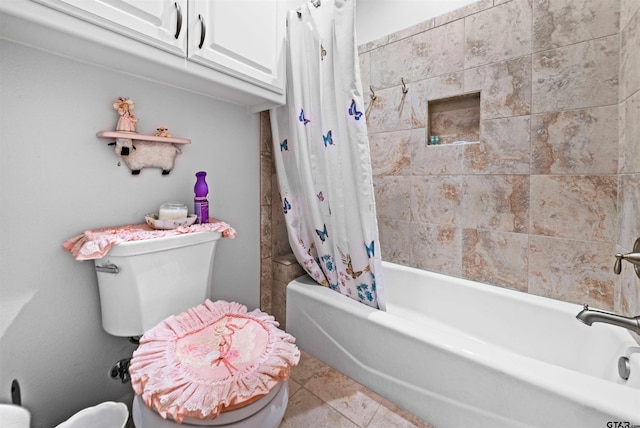 bathroom with tile patterned flooring, toilet, and shower / tub combo with curtain