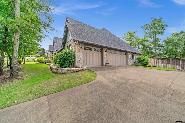 view of home's exterior featuring a garage and a lawn