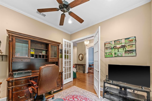 office space featuring ceiling fan, light wood-type flooring, french doors, and ornamental molding