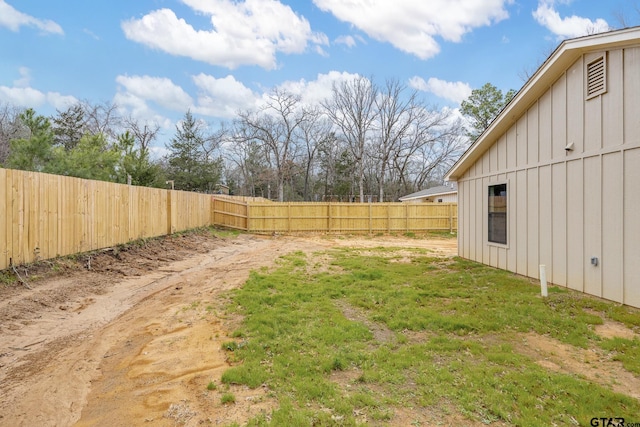 view of yard with a fenced backyard