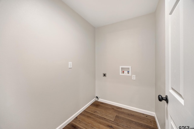 clothes washing area featuring laundry area, washer hookup, baseboards, dark wood finished floors, and electric dryer hookup