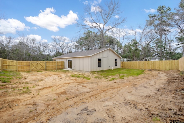 back of house featuring fence