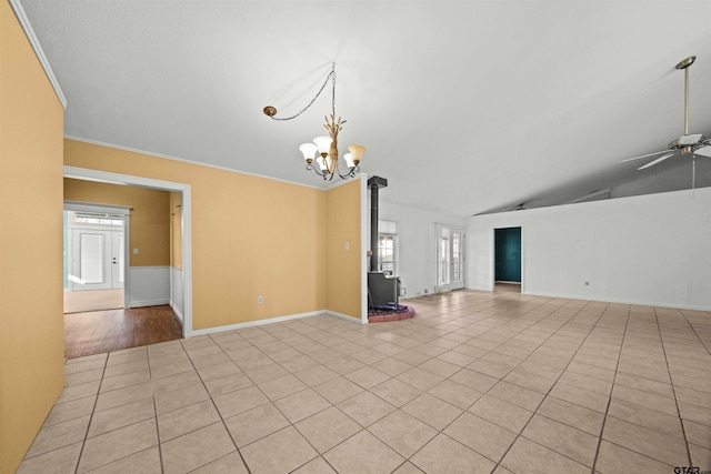 unfurnished living room featuring lofted ceiling, ceiling fan with notable chandelier, crown molding, and light tile patterned flooring