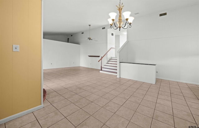 spare room featuring light tile patterned floors, ceiling fan with notable chandelier, and high vaulted ceiling