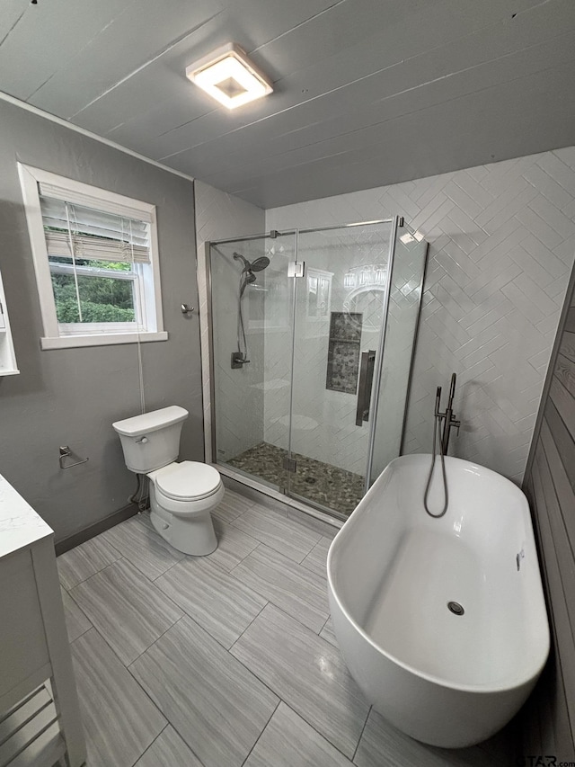 606 Glazner St, Hawkins, TX 75765 - full bathroom with a soaking tub, a stall shower, vanity, and toilet