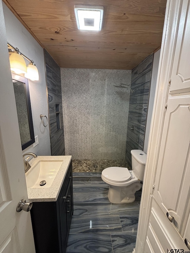 606 Glazner St, Hawkins, TX 75765 - bathroom with vanity, toilet, tiled shower, and wooden ceiling