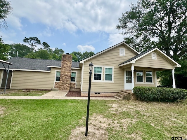 606 Glazner St, Hawkins, TX 75765 - rear view of property featuring a lawn, a chimney, and a shingled roof