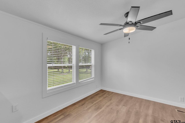 441 N Hill, Tyler, TX 75706 - unfurnished room featuring light wood-style floors and ceiling fan