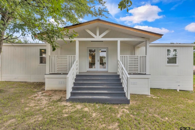 441 N Hill, Tyler, TX 75706 - view of exterior entry with covered porch, french doors, a yard, and crawl space