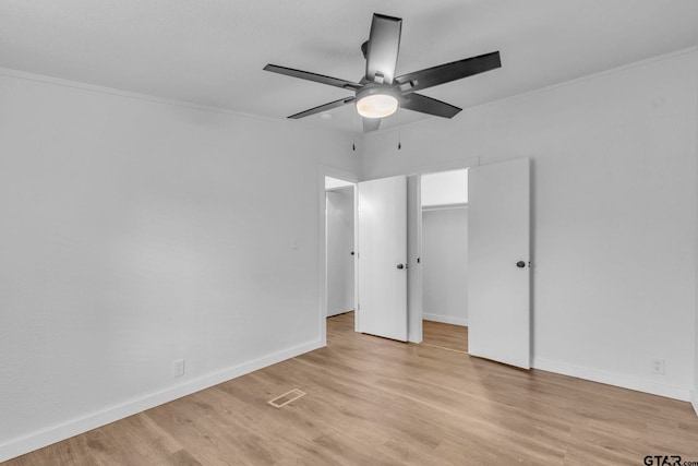 441 N Hill, Tyler, TX 75706 - unfurnished bedroom featuring light wood-style floors, ceiling fan, and crown molding