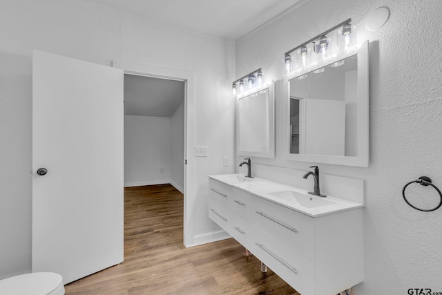 441 N Hill, Tyler, TX 75706 - bathroom featuring double vanity and wood finished floors