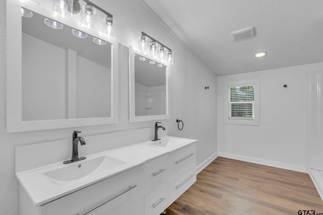 441 N Hill, Tyler, TX 75706 - bathroom with double vanity, wood finished floors, and recessed lighting