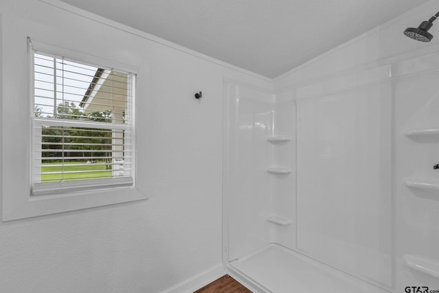 441 N Hill, Tyler, TX 75706 - bathroom featuring a shower, ornamental molding, and wood finished floors
