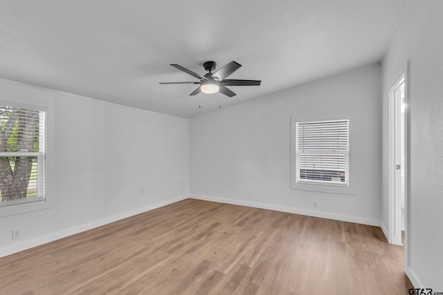 441 N Hill, Tyler, TX 75706 - unfurnished room with light wood-style flooring and ceiling fan