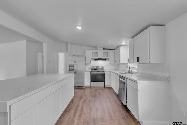 441 N Hill, Tyler, TX 75706 - kitchen with stainless steel appliances, lofted ceiling, dark wood-style flooring, white cabinets, and under cabinet range hood