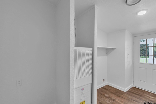 441 N Hill, Tyler, TX 75706 - laundry room with a heating unit and wood finished floors