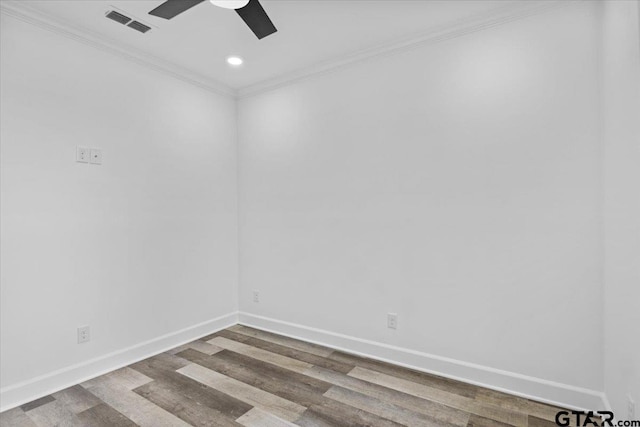 spare room with hardwood / wood-style floors, ceiling fan, and crown molding