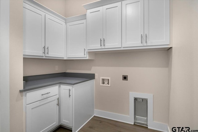 washroom with cabinets, hookup for a washing machine, dark hardwood / wood-style floors, and electric dryer hookup