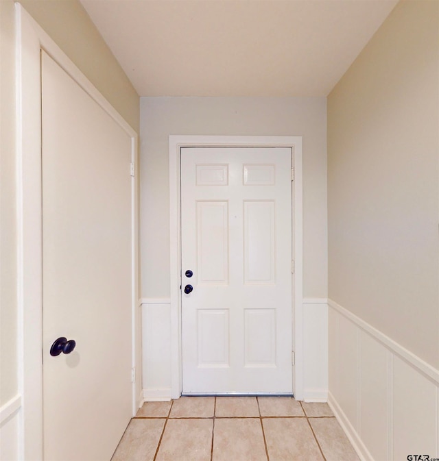 entryway with light tile patterned floors