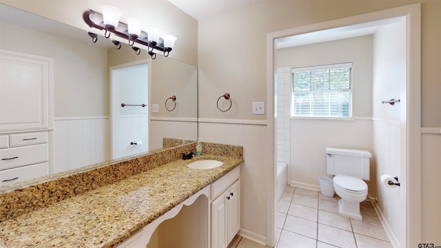 full bathroom featuring tile patterned floors, vanity,  shower combination, and toilet