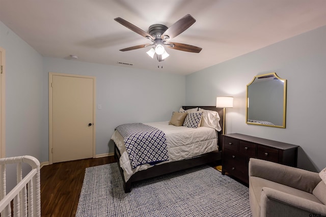 bedroom featuring ceiling fan and dark hardwood / wood-style floors