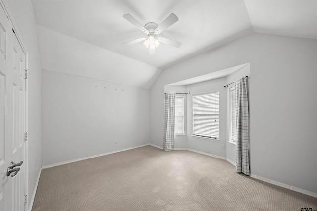 bonus room featuring light colored carpet, ceiling fan, and lofted ceiling