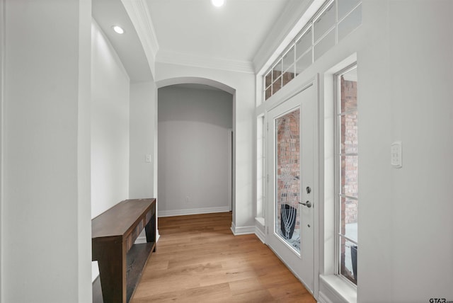 hall with crown molding and light wood-type flooring