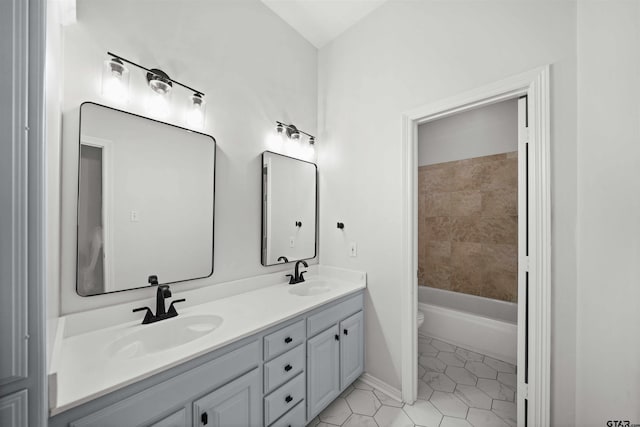 full bathroom with tile patterned flooring, vanity, shower / bathtub combination, and toilet