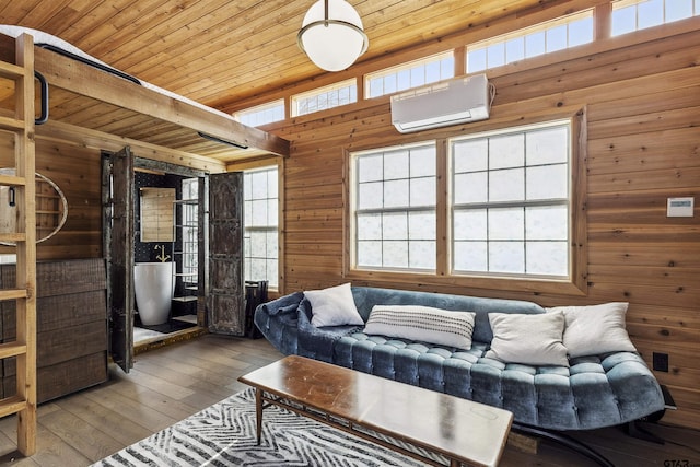 living room featuring an AC wall unit, wood walls, hardwood / wood-style flooring, wood ceiling, and beam ceiling